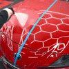 Detailrs CeramicSeal supra waterafstotende coating test op glanzende rode auto motorkap