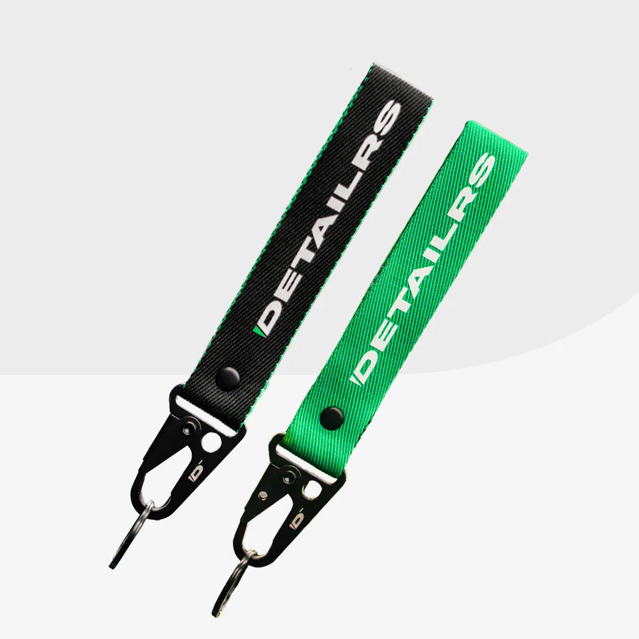 Detailrs sleutelhanger set met zwarte en groene band, met metalen karabijnhaak en sleutelring